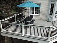 <b>Trex Transcend Island Mist Composite Deck Boards with White Washington Vinyl Railing with round aluminum balusters and a matching drink rail 3</b>